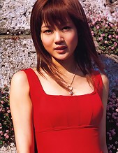 Cute asian girl is flirtatious with her long hair in a dress