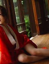 Japanese tramp with an open red kimono waiting for her next fucking appointment