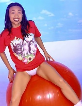 Cute asian honey spreads her tight pussy and plays with red balloon between legs
