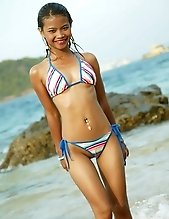 Tussinee posing in a bikini on the beach