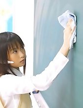 Asian slut dresses the part of a school girl and cleans up the class room